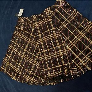 Red/gold sequin skirt tags on brand new. Torrid size 2